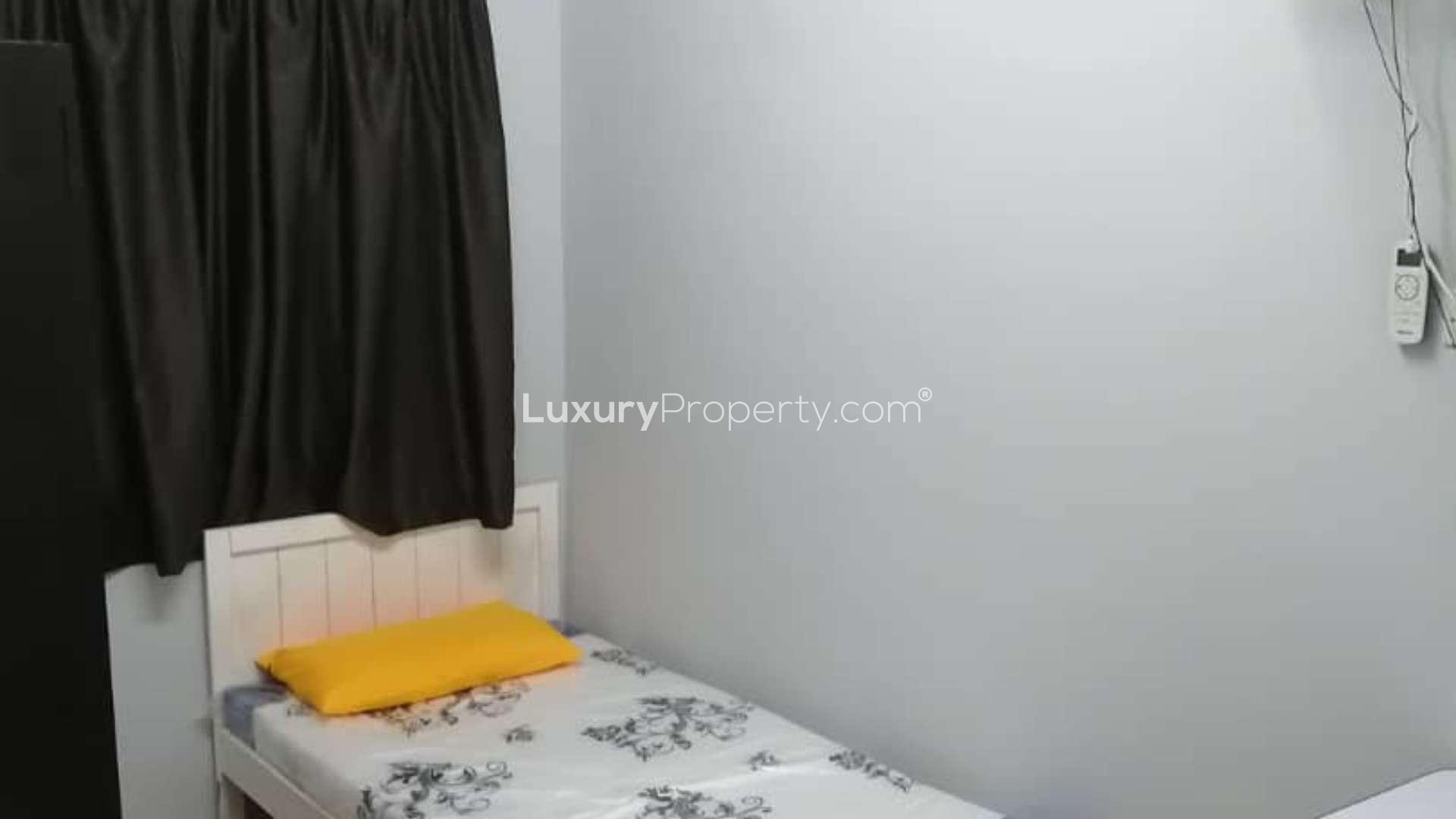 Single bed with floral bedding in Taman Bukit Indah terrace house, Johor Bahru